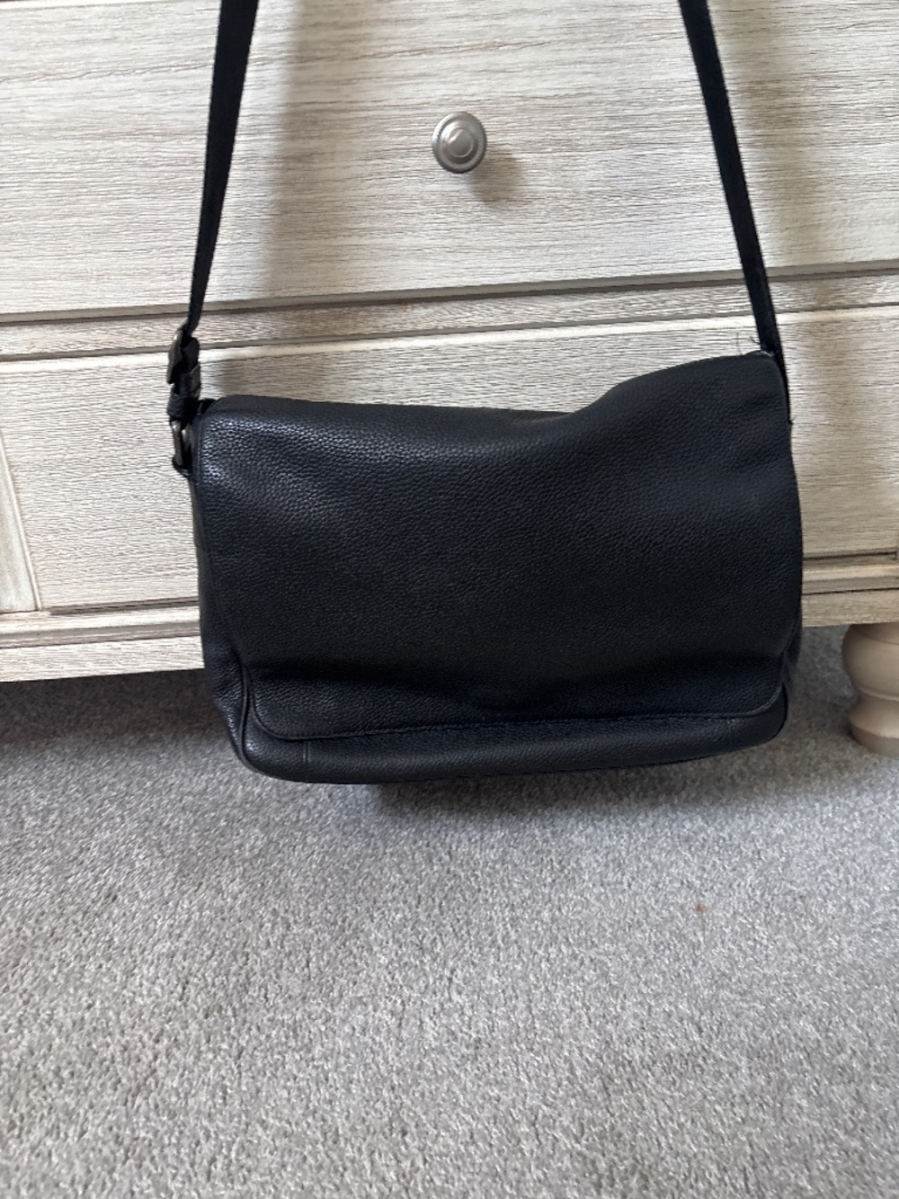 Coach black pebble messenger bag